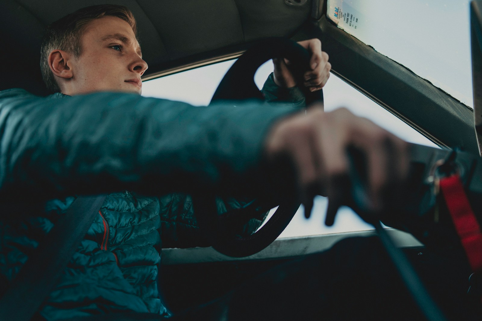man wearing black jacket driving on vehicle, auto